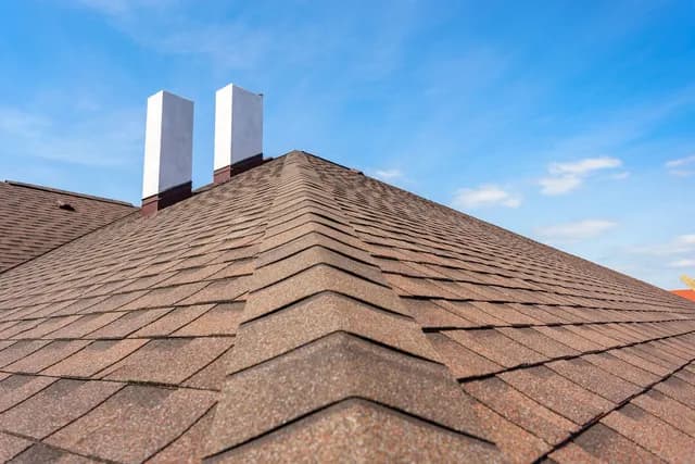 What is a Chimney Cricket, and Does Your Roof Need One?